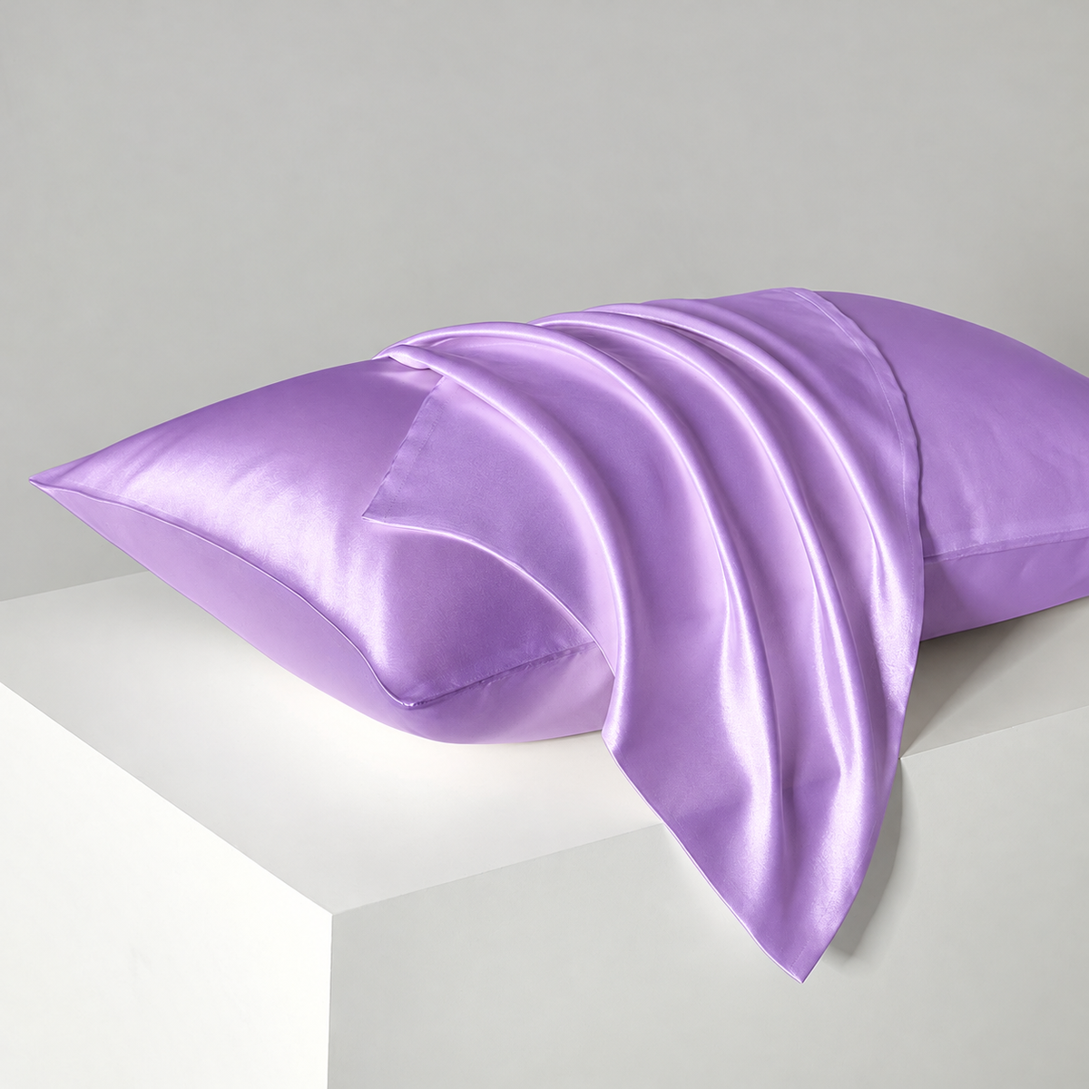 Purple satin pillowcases — diagonal studio view