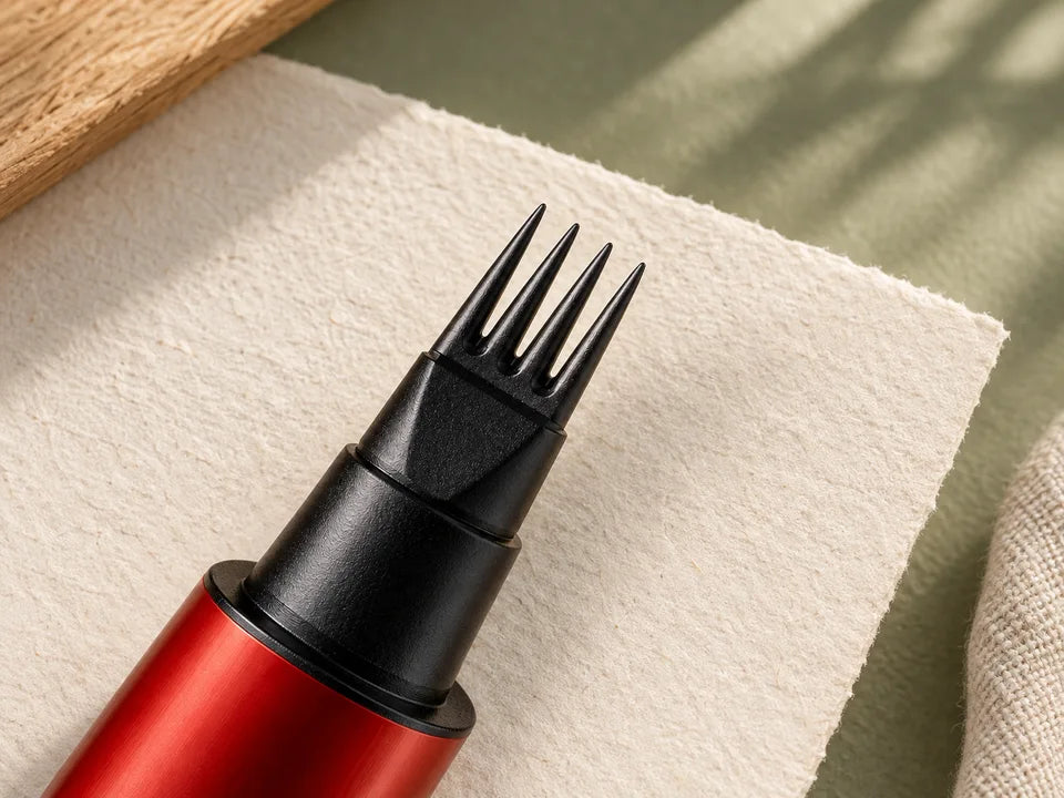 Close-up of the four-prong applicator on a red brow pen